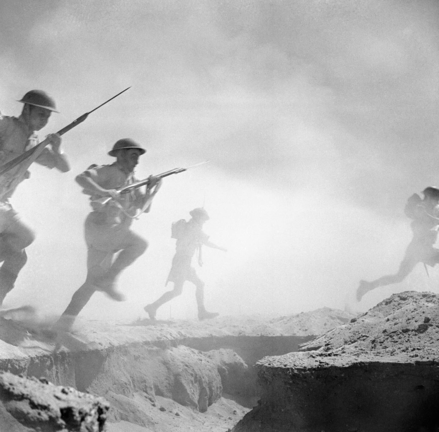British infantry advances through the dust and smoke in Egypt.